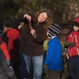 Prairie School of DuPage Photo - A teacher points out the details in a leaf during morning outdoor observations.