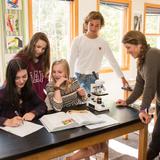 Steamboat Mountain School Photo #5 - Ms. Durkan works with students in the Biology lab.