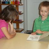 Boulder Knoll Montessori School Photo #8 - Reading to each other.