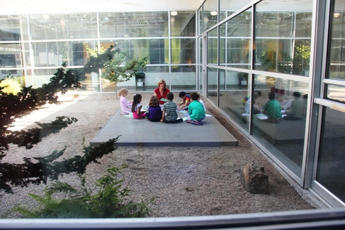Fraser Woods Montessori School Photo - Taking the classroom outdoors to the Zen Garden