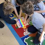 St. Luke Catholic School Photo #8 - First grade learns about light in Science. How much fun can we cram into learning! It is a safe bet that these children will always remember creating rainbows!