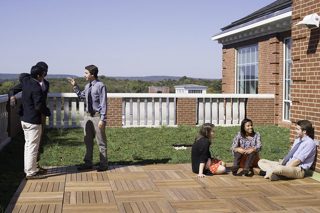 Suffield Academy Photo - Students enjoy a nice day on the patio of newly renovated Holcomb Science Center.