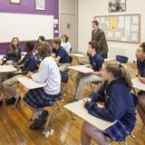 Holy Trinity School Photo #6 - Fr. Kevin Gillespie, SJ, Pastor at Holy Trinity, visiting an Upper School classroom