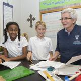 Our Lady Of Victory School Photo #1 - Middle School students enjoy math class with OLV principal Sheila Martinez.