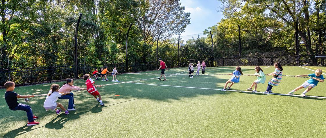 Washington International School Photo #1 - The Primary School outdoor play area includes a field used for a variety of activities.