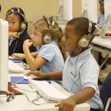 Abundant Life Christian Academy Photo #2 - Kindergarten students practicing typing skills in computer class.