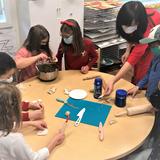 Guidepost Montessori at Lake Norman Photo #5 - Culture is an important component of our curriculum. Here, students are learning to cook dumplings in celebration of the Lunar New Year.