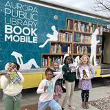 Compositive Primary, Preschool - 5th Gd Photo #14 - We love collaborating with the Aurora Public Library! The Bookmobile visits once per month so students can borrow and return books!