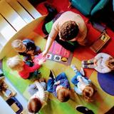 Our House Montessori Photo - Our House Montessori toddler students getting a language lesson