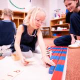 Hand In Hand Christian Montessori Photo #4 - Our teachers get on the ground and work with the students at their level.
