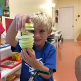 Montessori By The Sea Photo #2 - Making applesauce from scratch. Practical Life activities are a way of life in our Montessori classrooms.