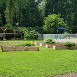 Learning Tree Elementary School Photo #4 - New Growing Place Gardens and Creekside Classroom next to McLellan Creek. See our website for more pictures of our abundant outdoor learning spaces.