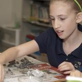 Midway Covenant Christian School Photo #8 - In fifth grade the students examine owl pellets for a science lab.