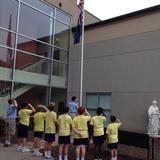 St. Joseph Catholic School Photo - The raising of the flag happens every day! Our morning announcements begin with prayer, the pledge of allegiance and St. Joseph school pledge.
