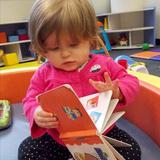 Westbrook KinderCare Photo #4 - Caralynn enjoying one of her favorite books.