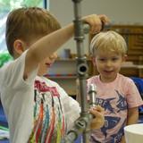 Brickton Montessori School Photo #2 - Team. Work. Two heads can be better than one when there’s a challenge to puzzle out. In a Montessori classroom, children often spontaneously come together to find practical solutions to everyday problems.