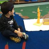 Park View Montessori School - Chicago Photo #3 - A child works independently to construct a wooden tower.